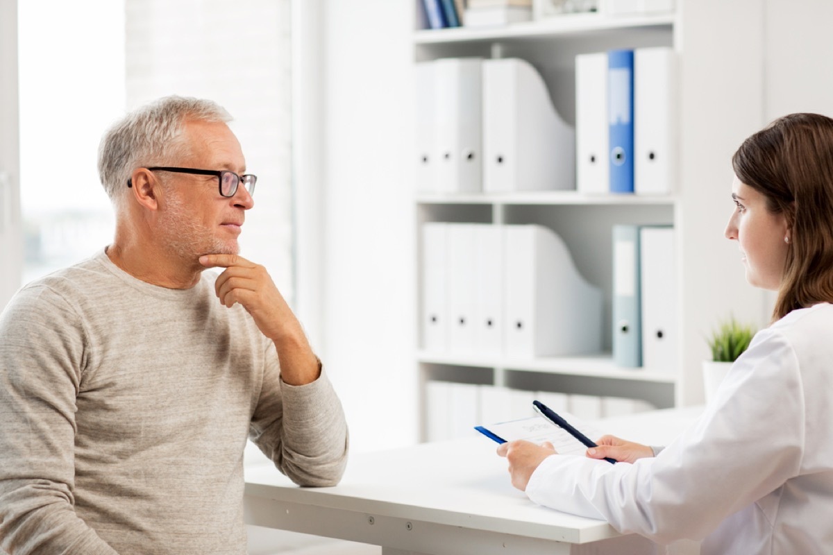 older man at checkup, health questions after 40