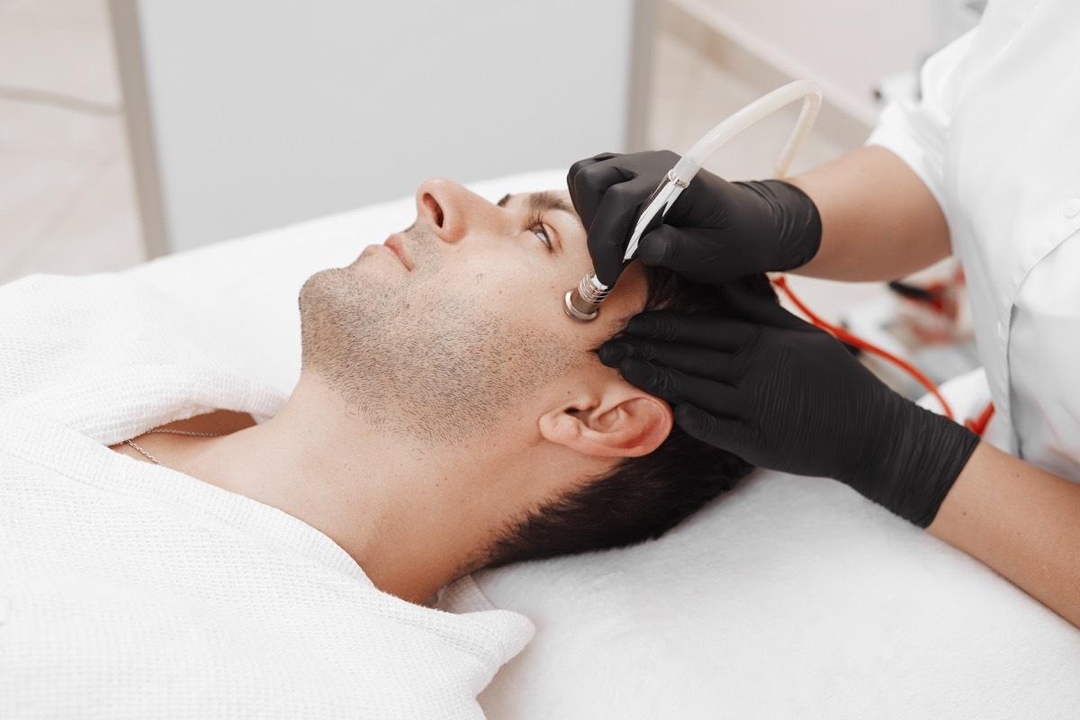Man getting microdermabrasion treatment