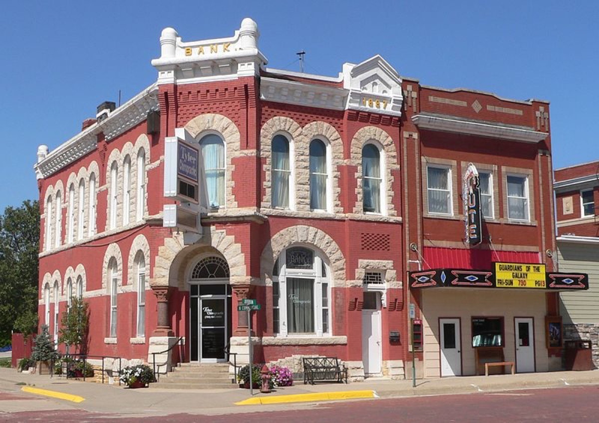 First National Bank building (left) and Ute Theater (right), located at northwest corner of Jefferson and Commercial Streets in Mankato, Kansas; seen from the southeast.