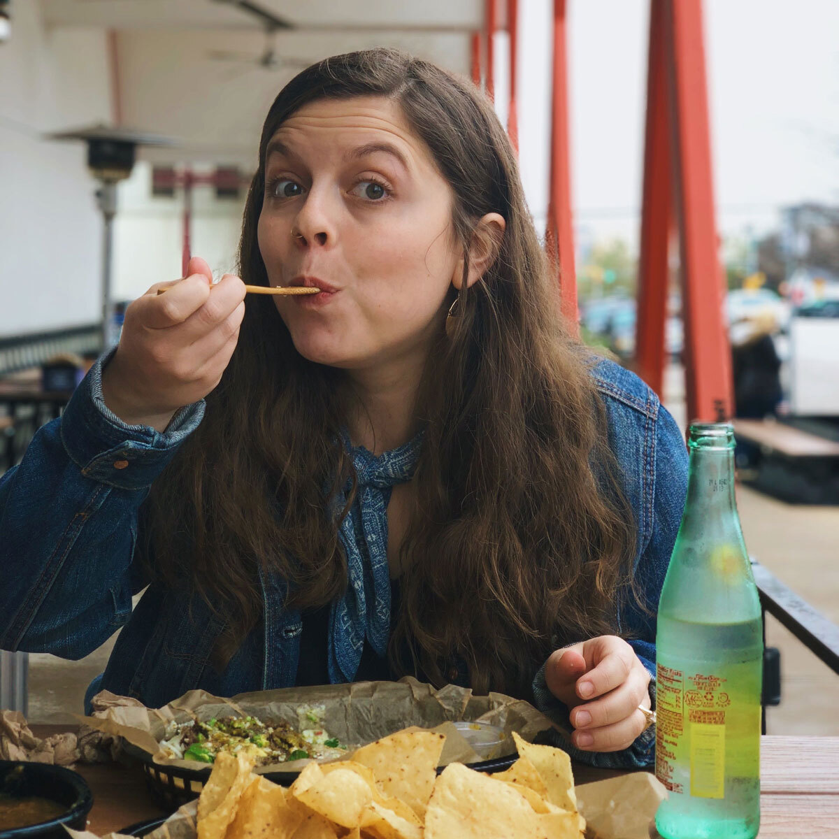 taking a bite of tacos in texas not dieting