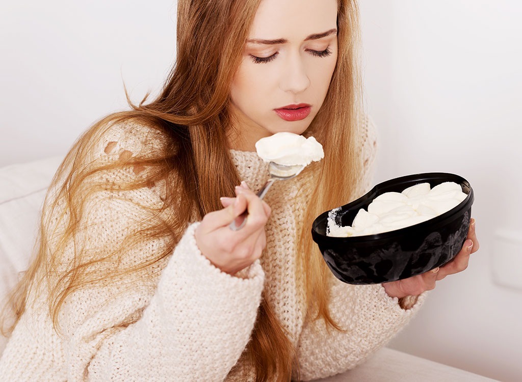 upset woman eating ice cream