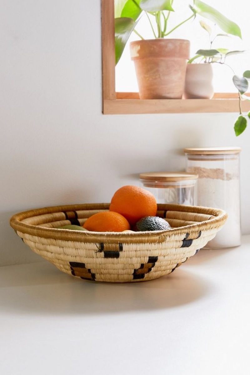 woven bowl with oranges in it, kitchen decorations