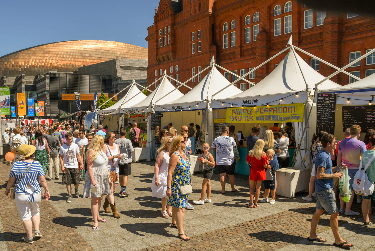 A crowd of people at an outdoor food festival