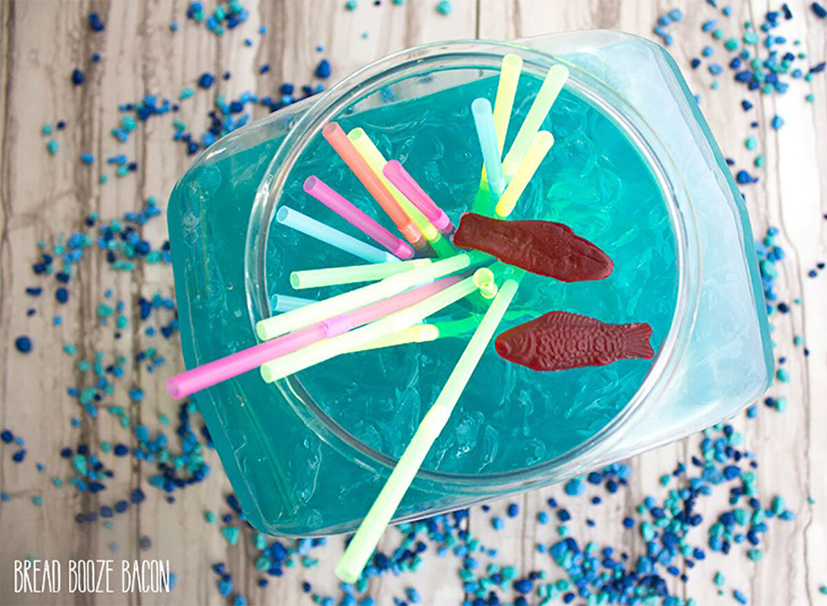 blue fishbowl cocktail with straws