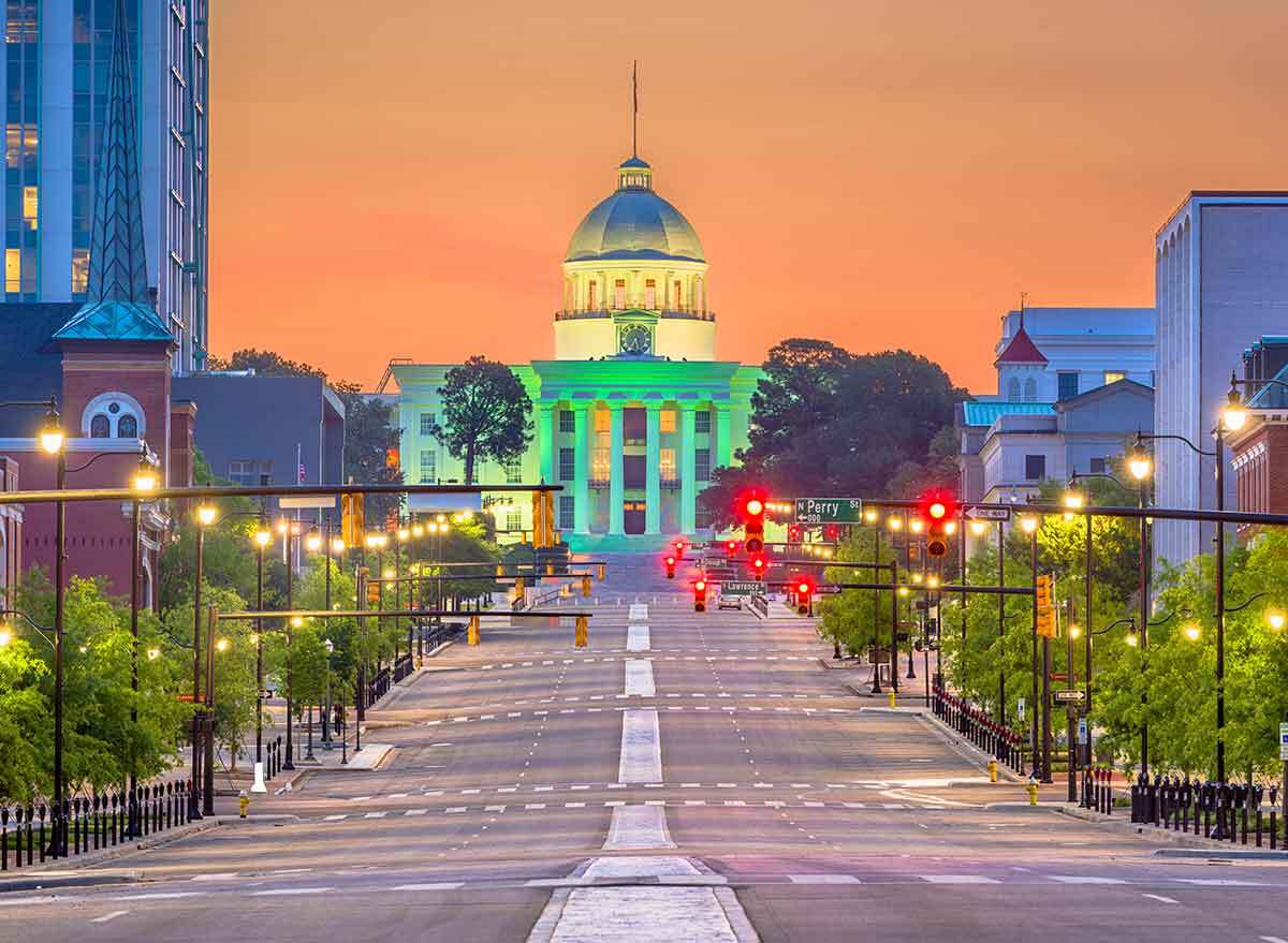 a street at dusk leading to the capitol building in montgomery