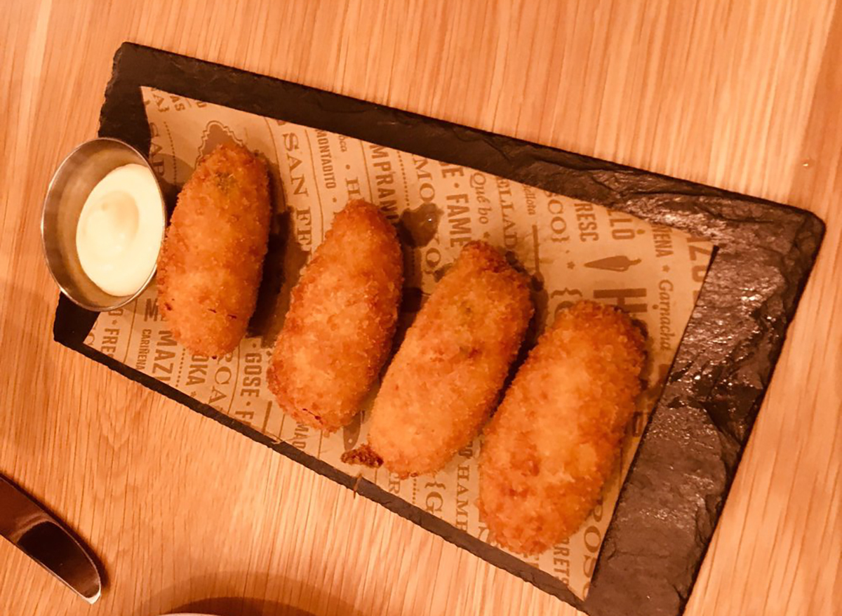 plate of chicken croquettes with dipping sauce