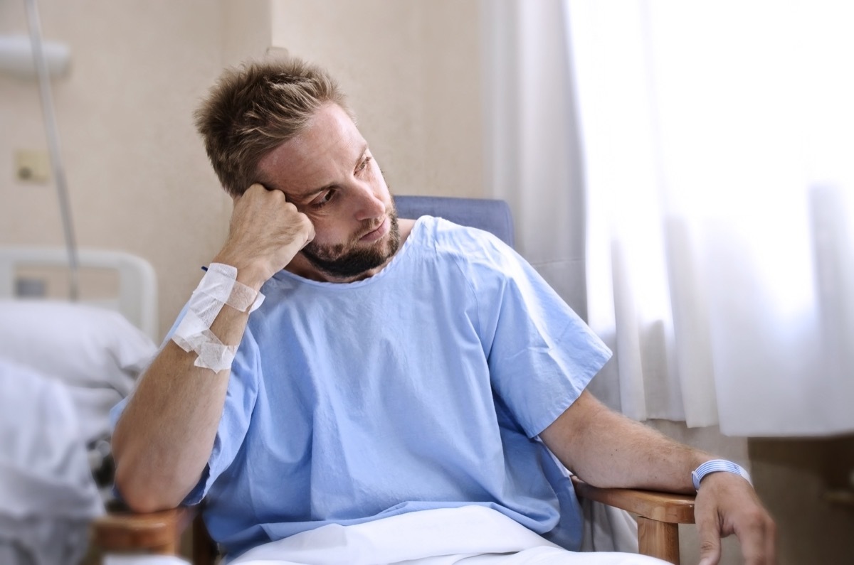 sick man, patient in hospital, sitting in hospital room