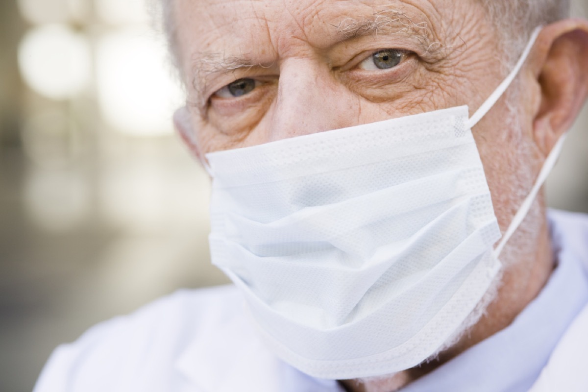 older man wearing paper mask over face, heart risk factors
