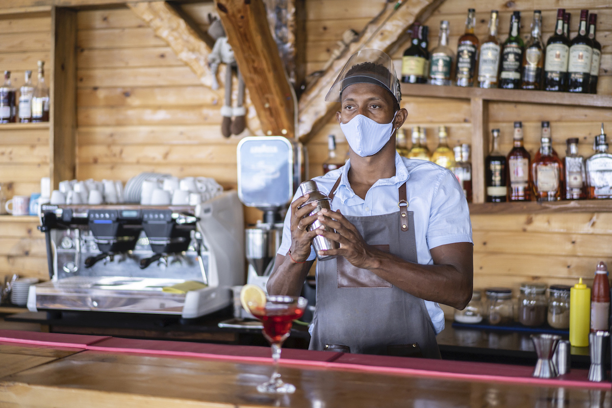 Disappointed bartender waiting for customers in times after coronavirus pandemic