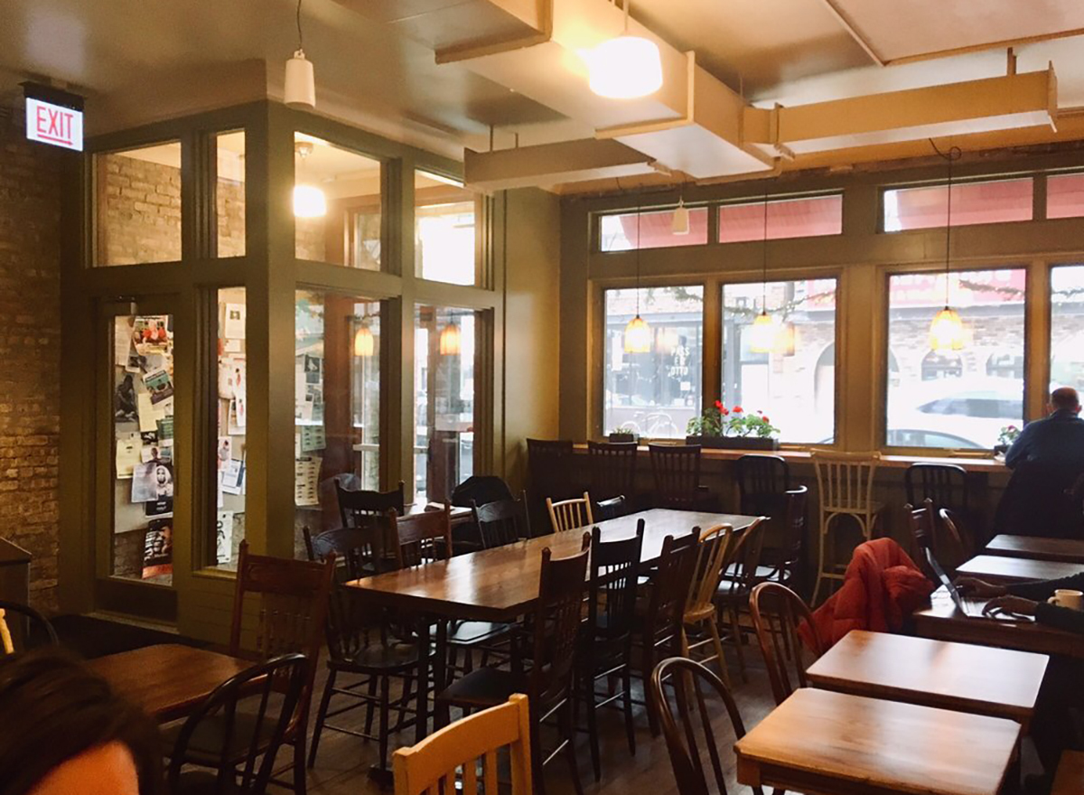 interior of colectivo coffee shop in chicago with tables and chairs