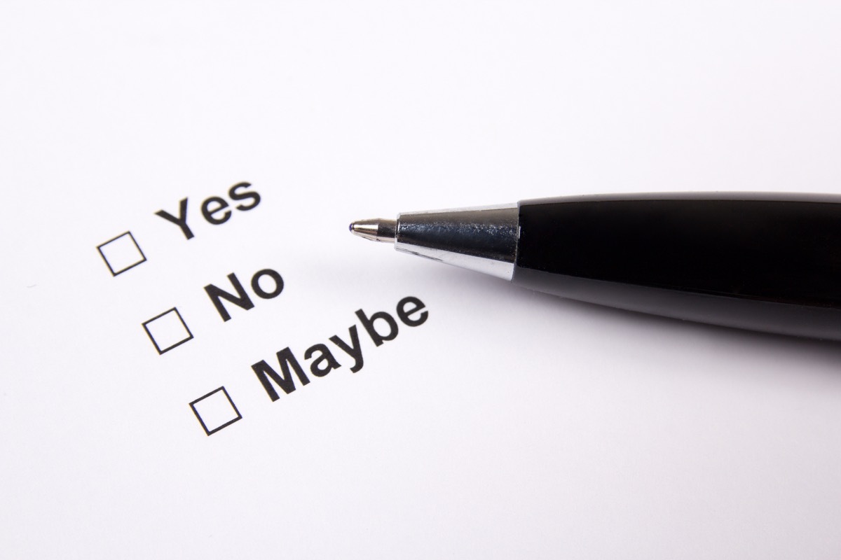 yes no maybe checklist with pen laying atop paper