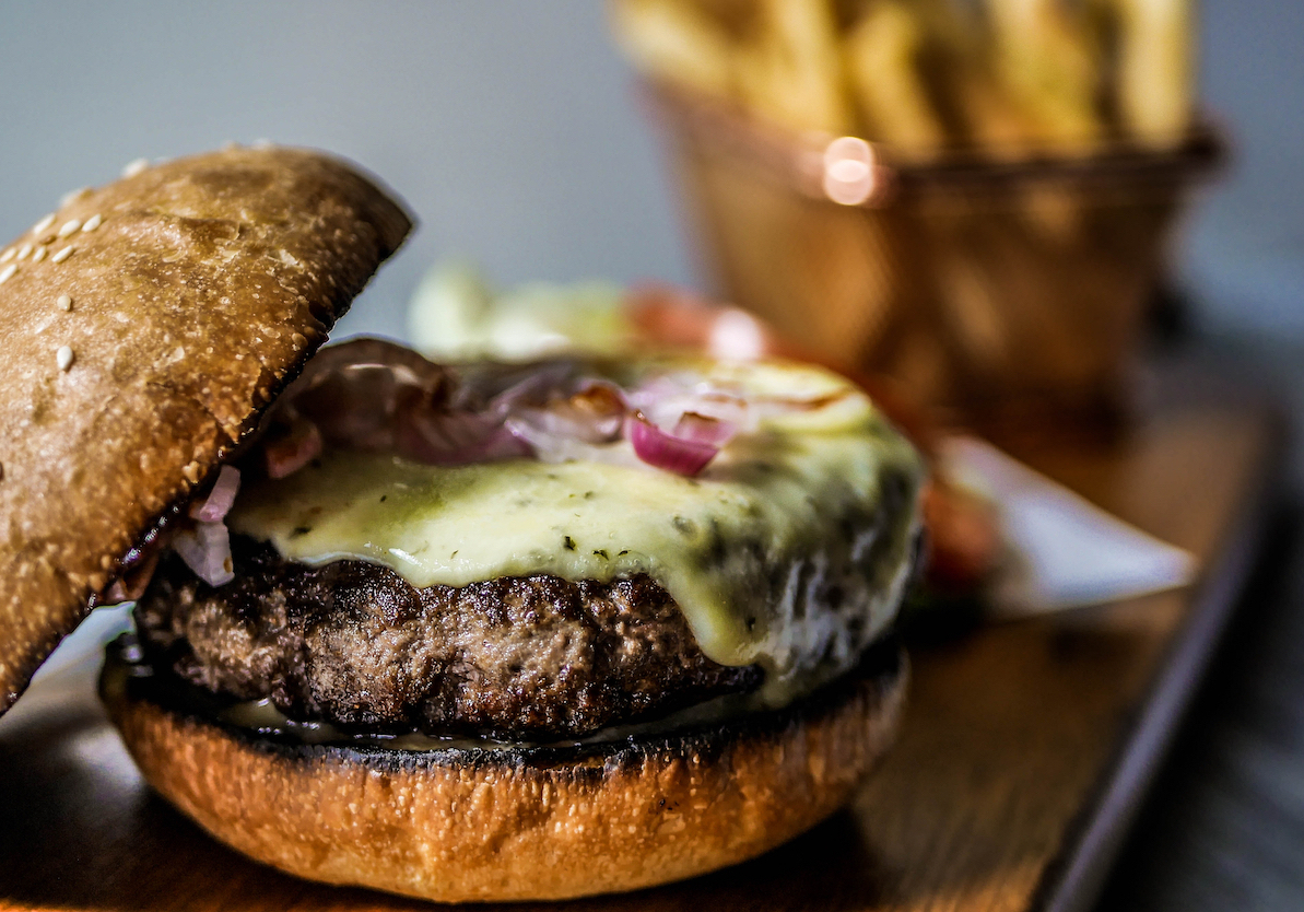 Wagyu Burger with fries in the background