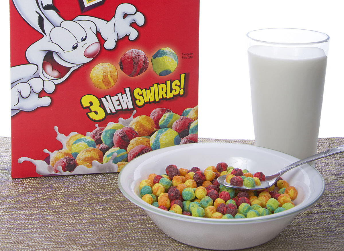 trix cereal box with bowl of cereal and glass of milk