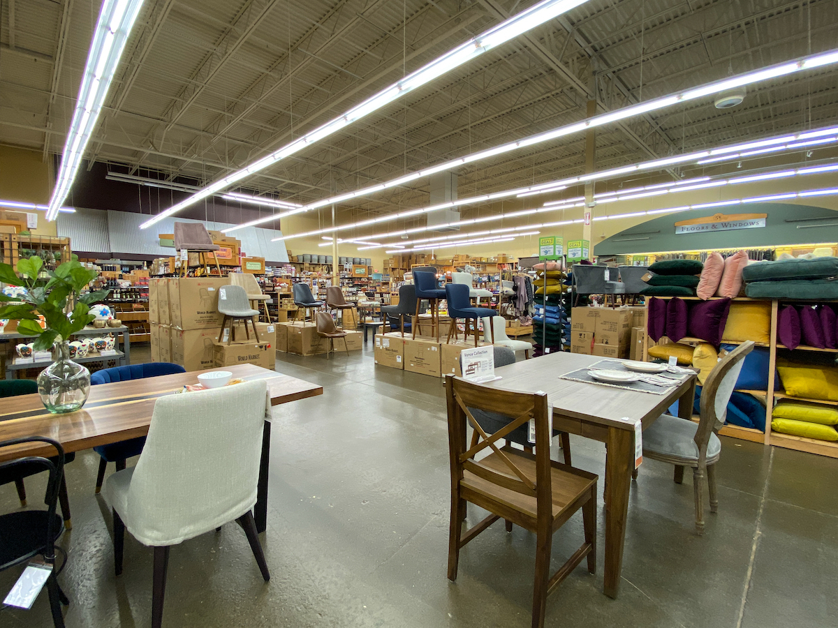 View of tables and chairs for sale at a Cost Plus World Market store.