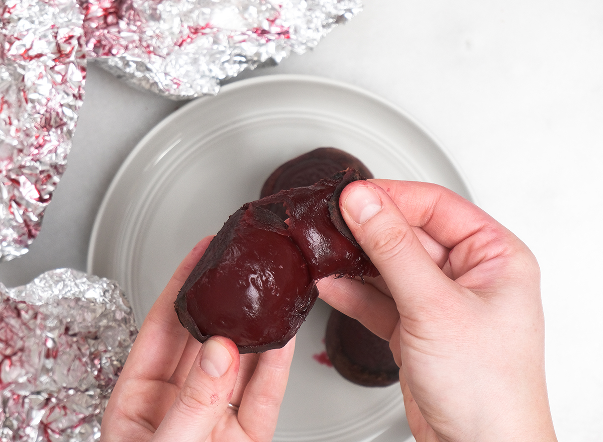 peeling roasted beet