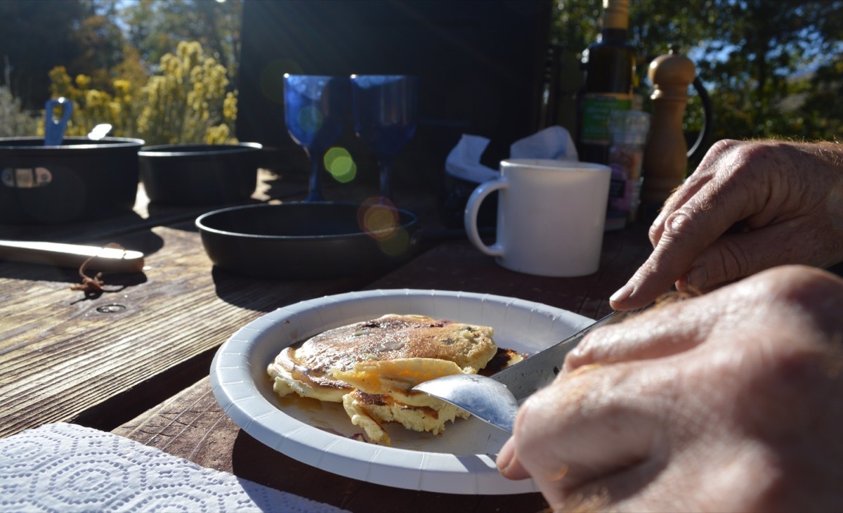 Eating Pancakes Outdoors When Camping in Autumn