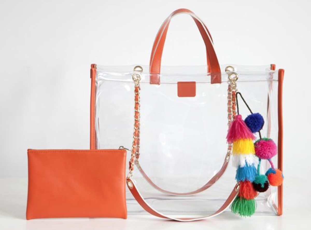 clear tote with pom poms, luxury beach bags