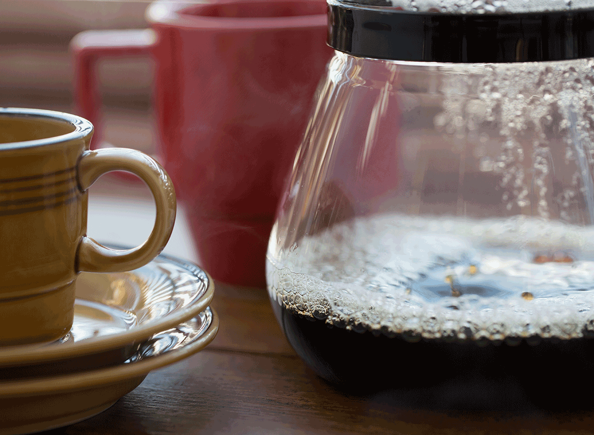 bubbling coffee pot next to mug