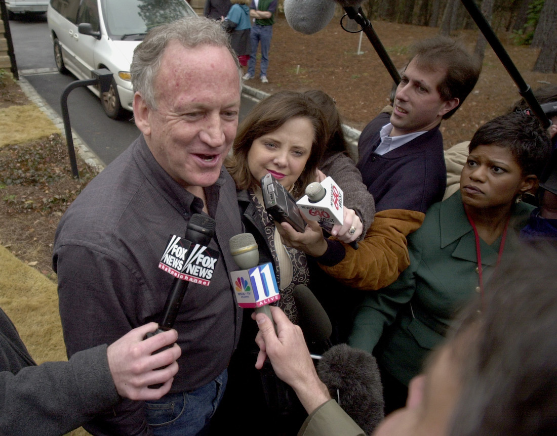 JonBenet Ramsey's parents speaking to reporters in 2001 after their home was broken into