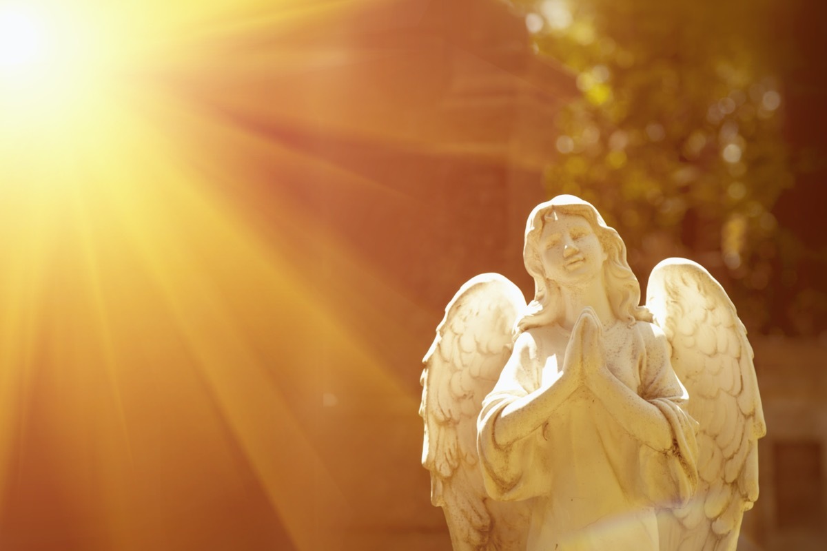 angel statue outdoors in sunlight
