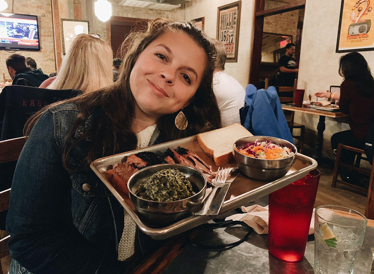 kiersten hickman with a plate of bbq in texas
