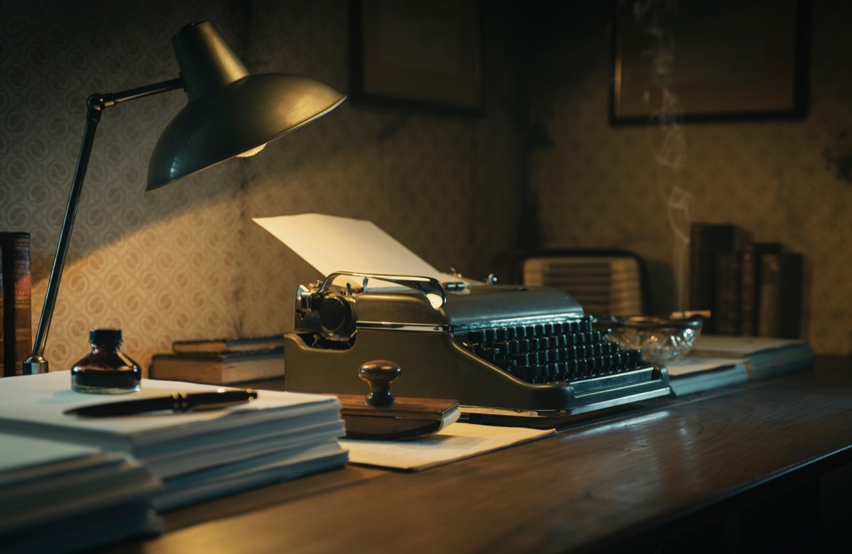 Office desk with vintage typewriter, 1950s film noir style