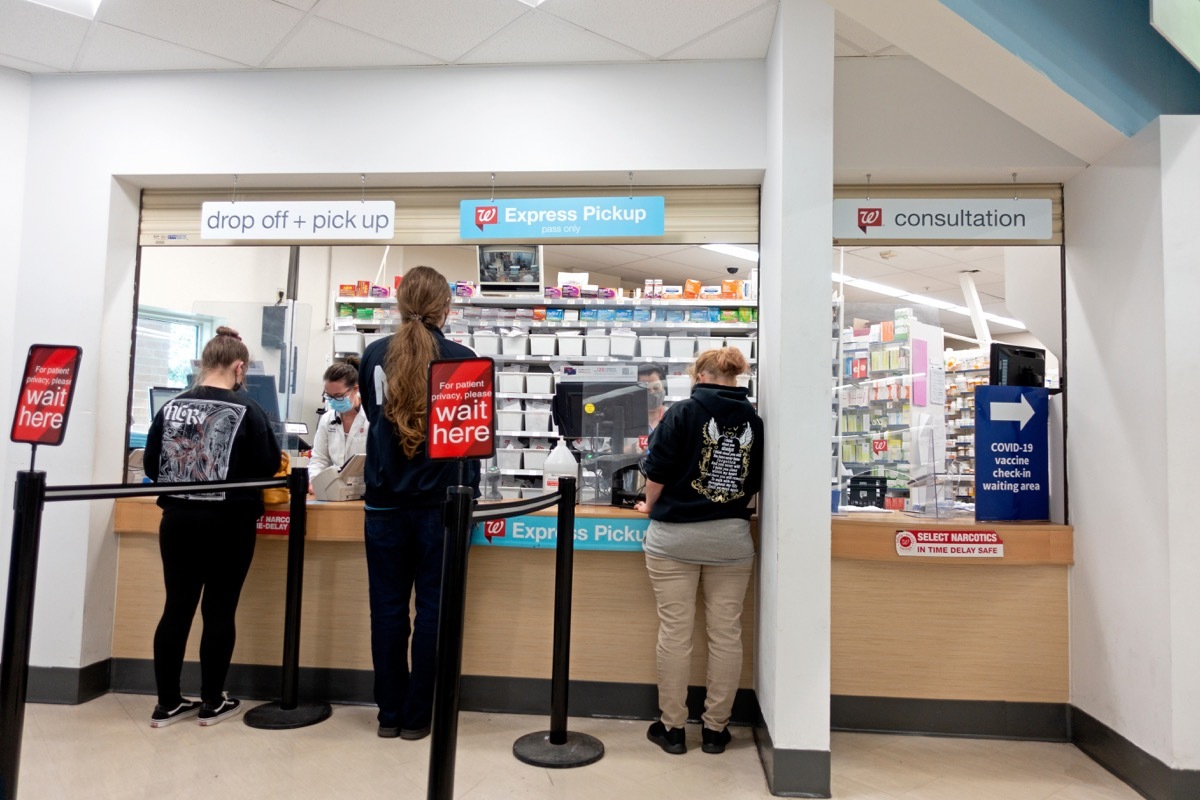 ST PAUL, MINNESOTA USA - SEPTEMBER 15, 2021: Customers being served at the Walgreens Pharmacy counter.