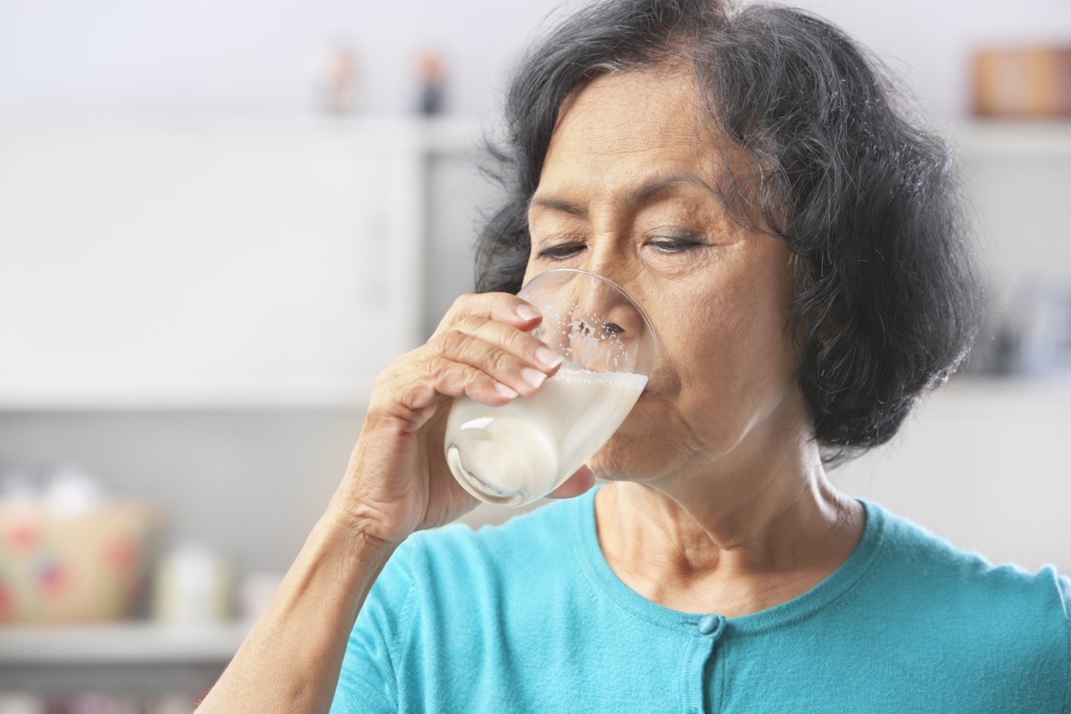 woman drinking milk at home