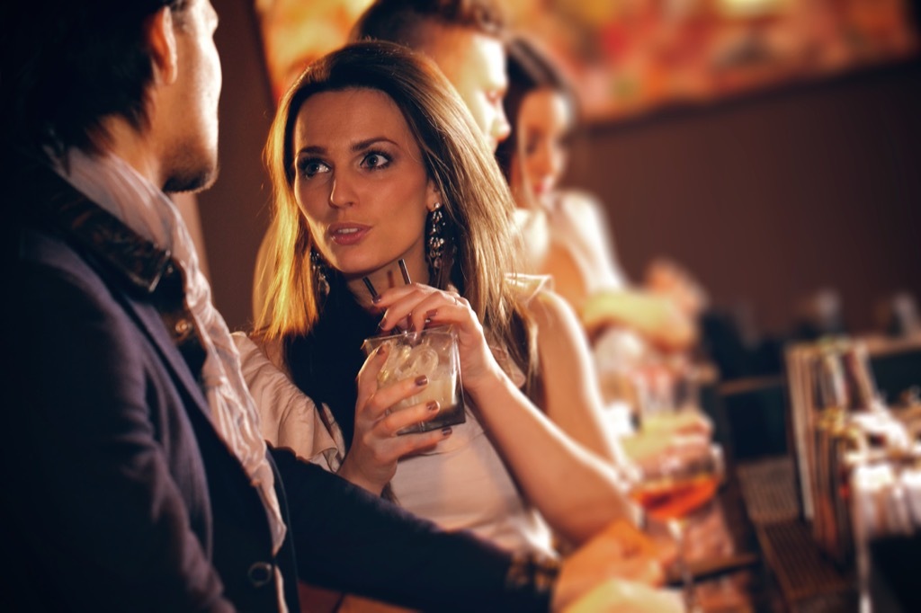 woman drinking at cocktail at the bar, should i be single