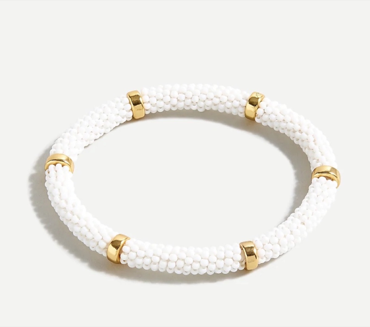 white beaded bangle with gold accents