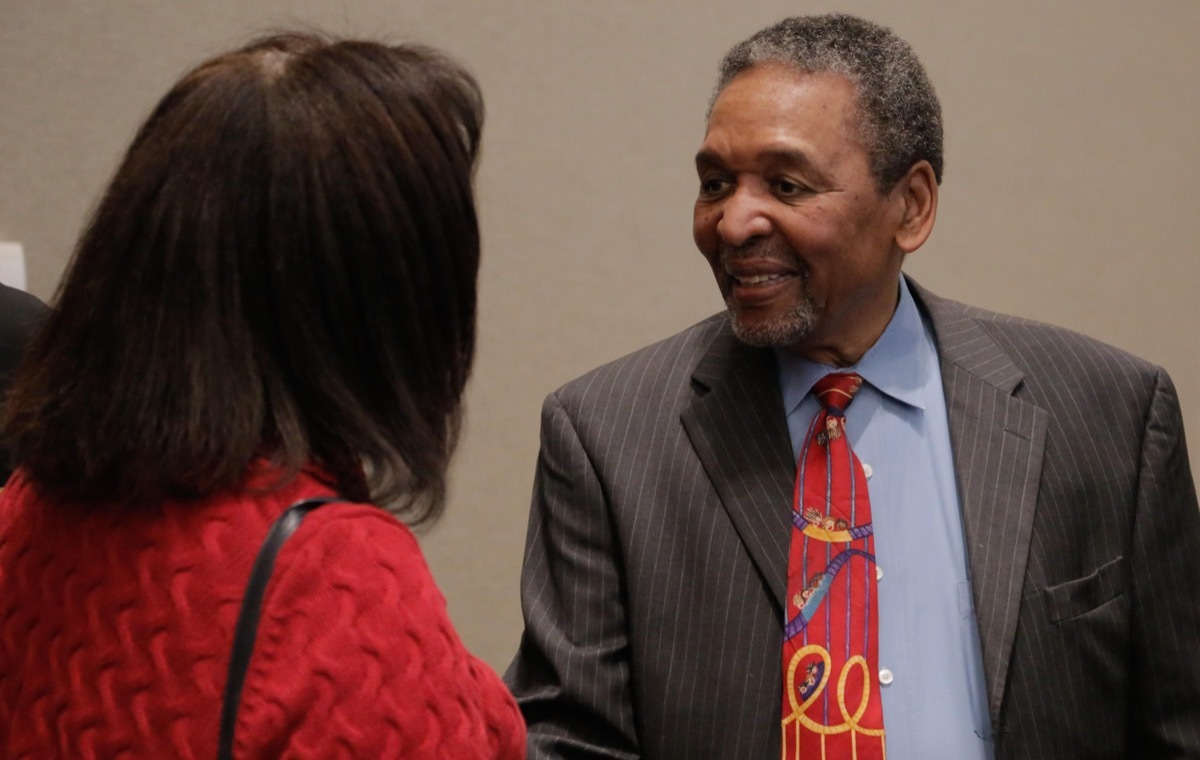 Dr. Frank Smith civil rights activist, historian, politician, museum founder, and keynote speaker at the Naval Surface Warfare Center Dahlgren Division sponsored 2018 African-American and Black History Month Observance  talks with a member of the audience after his keynote speech about the history and heroes of American civil rights and the Civil War. The civil rights activist is most recognized as the first person associated with the Student Nonviolent Coordinating Committee who registered voters in Mississippi.