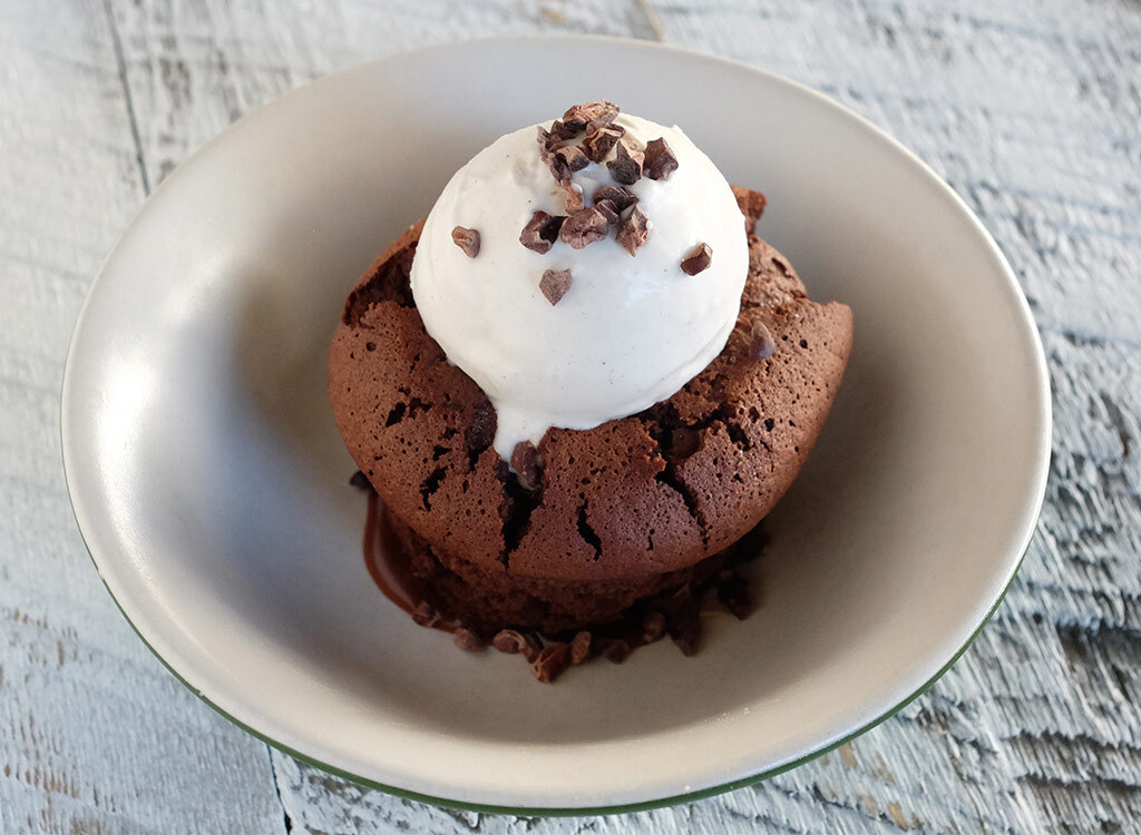 True food kitchen flourless chocolate cake with ice cream on top