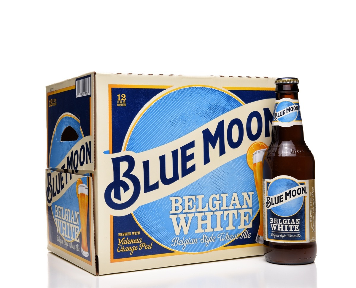 blue moon belgian white beer box with a bottle of beer in front of it