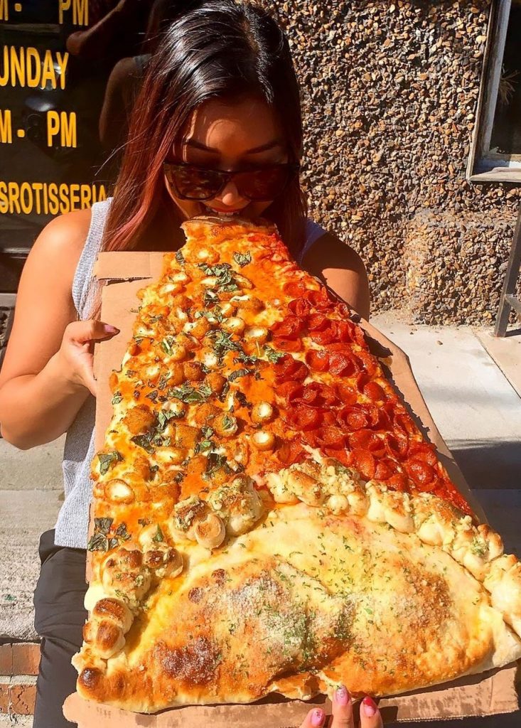  Viral pizza on social media | New Foodie Trend Is A Giant Pizza Slice – The Biggest You've Seen | Her Beauty