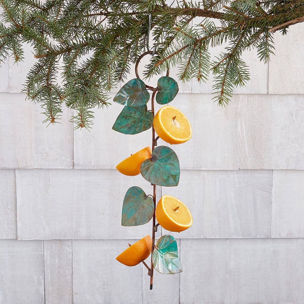birdie fruit feeder with metal leaves and orange halves