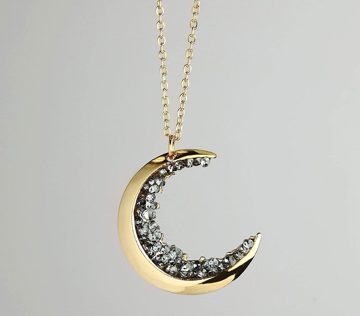 gold half moon necklace with black jewels