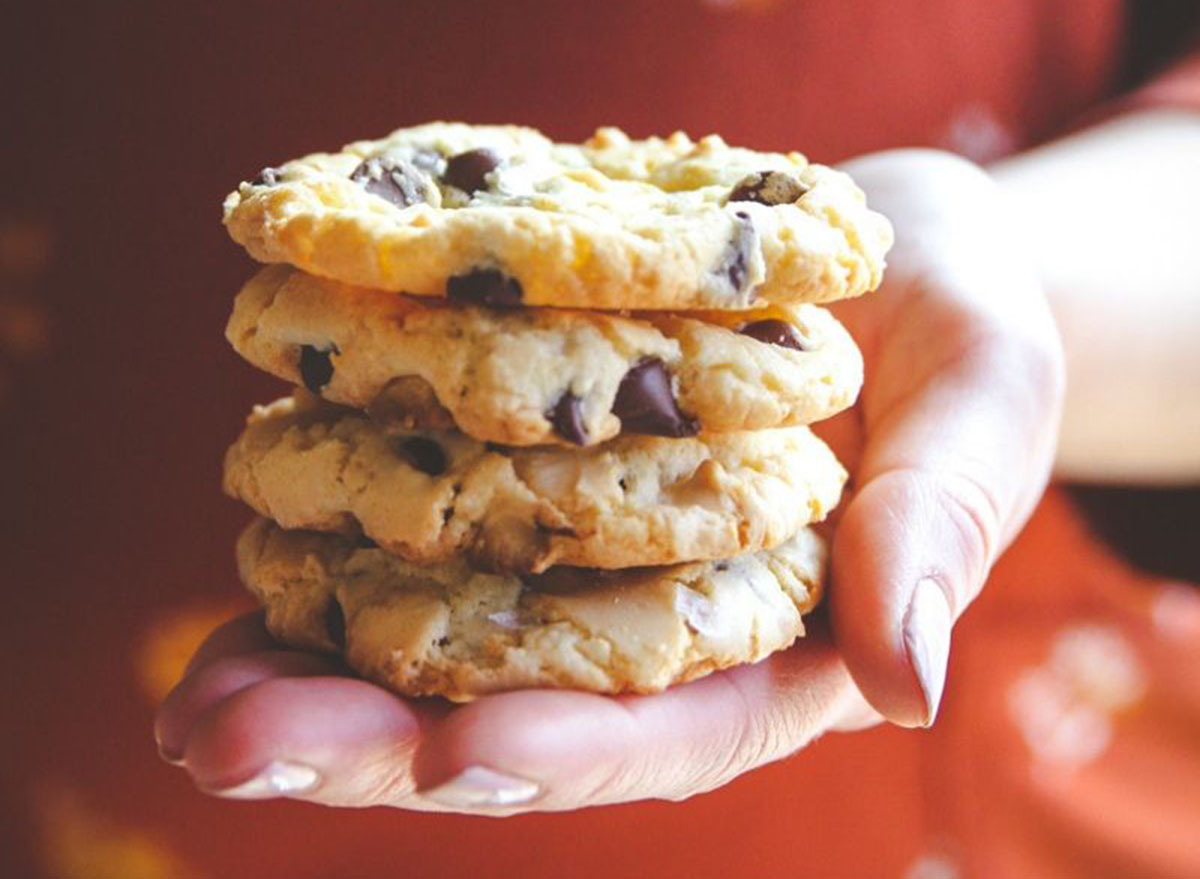 Someone holding a stack of tuxedo chocolate chip cookies