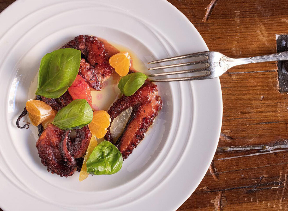 grilled octopus with citrus pieces
