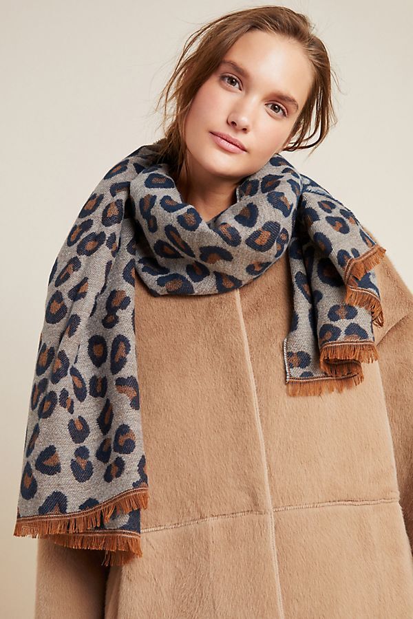 white woman wearing leopard scarf