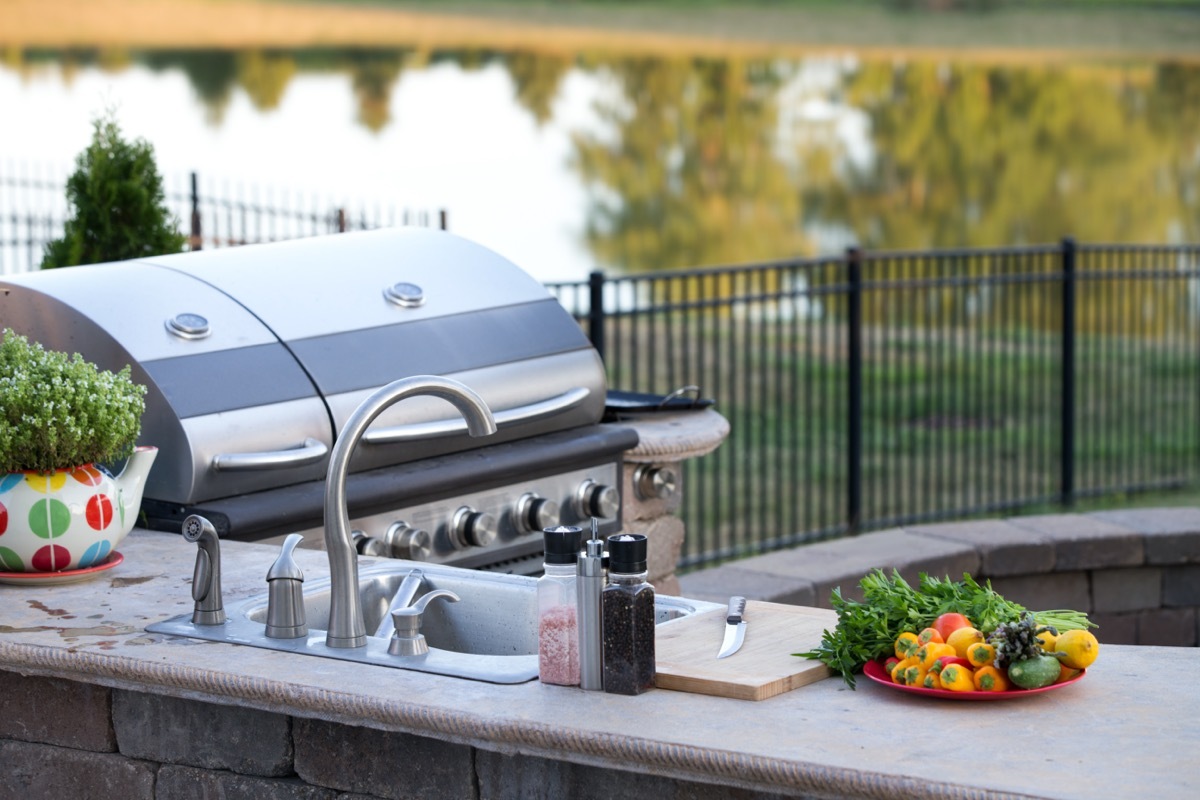 outdoor kitchen with stainless appliances