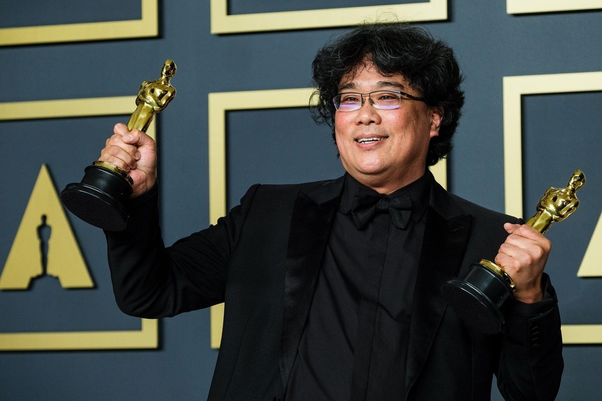 Bong Jon Ho poses with his Oscars after winning award for film 'Parasite' in February 2020
