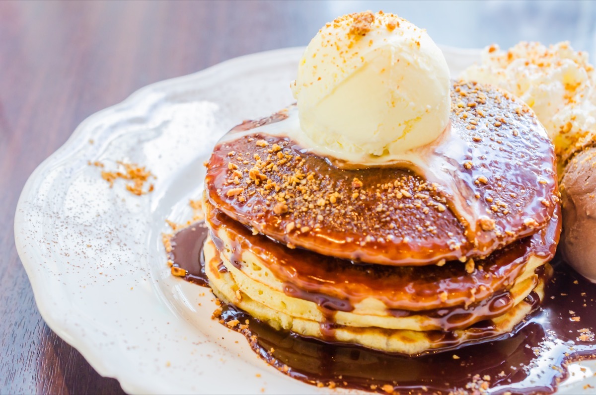 Pancakes serves with chocolate sauce and ice cream