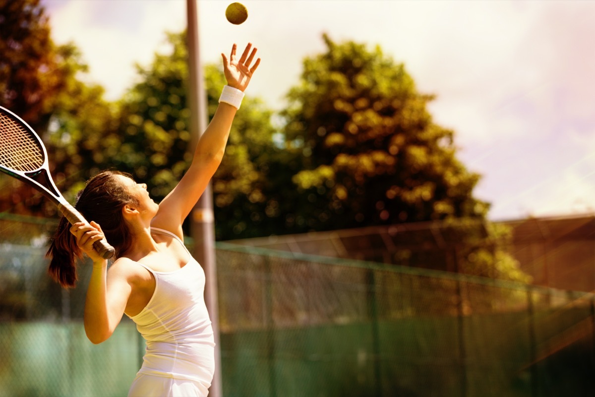 women serving a tennis ball, hiring manager tips
