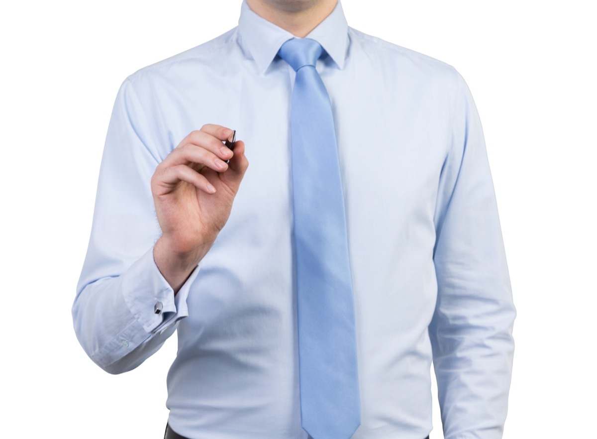 man wearing light blue shirt and light blue tie