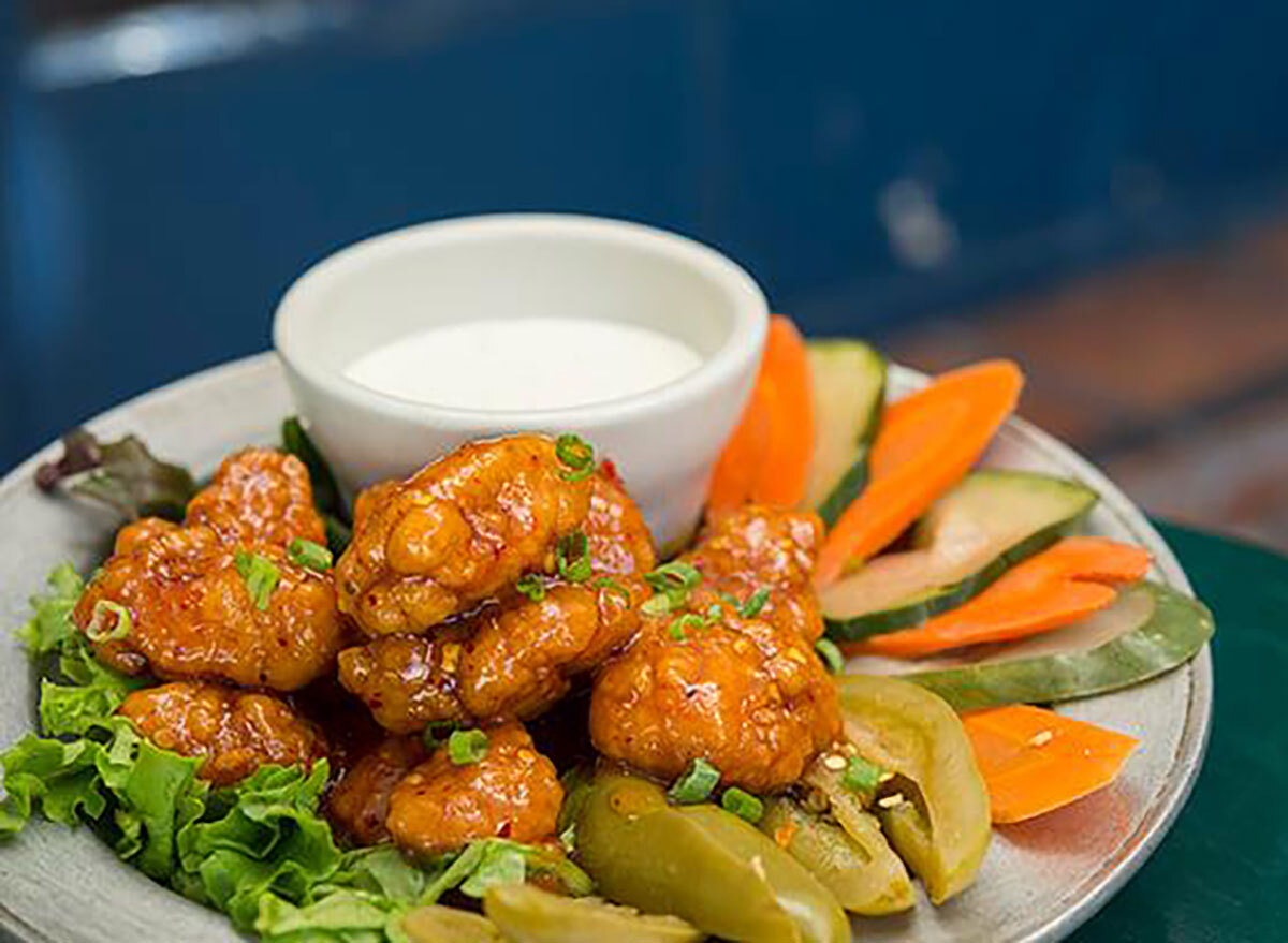 wings with carrots and cucumber slices and ranch dip