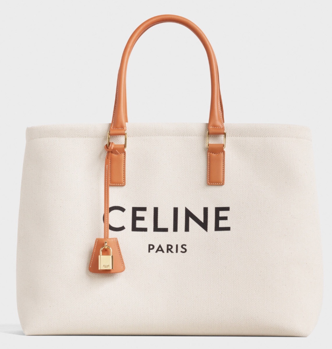 white canvas tote with leather handle and celine logo, luxury beach bags