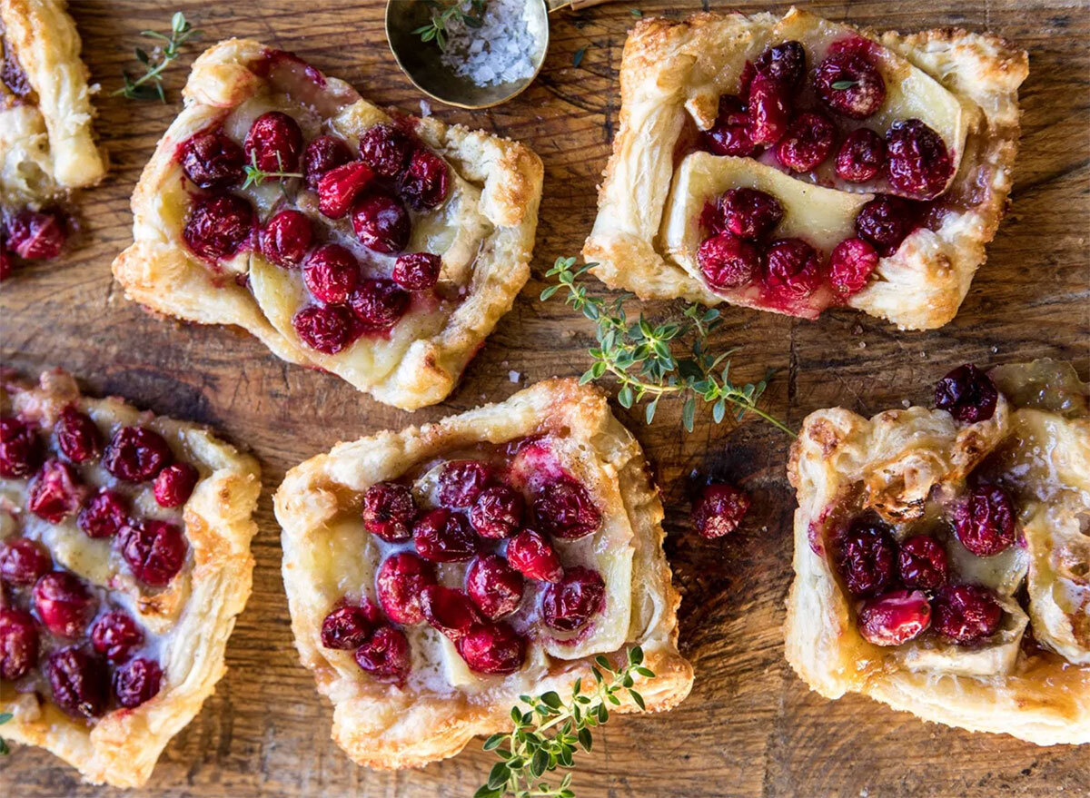 cranberry brie pastry tarts on wooden board
