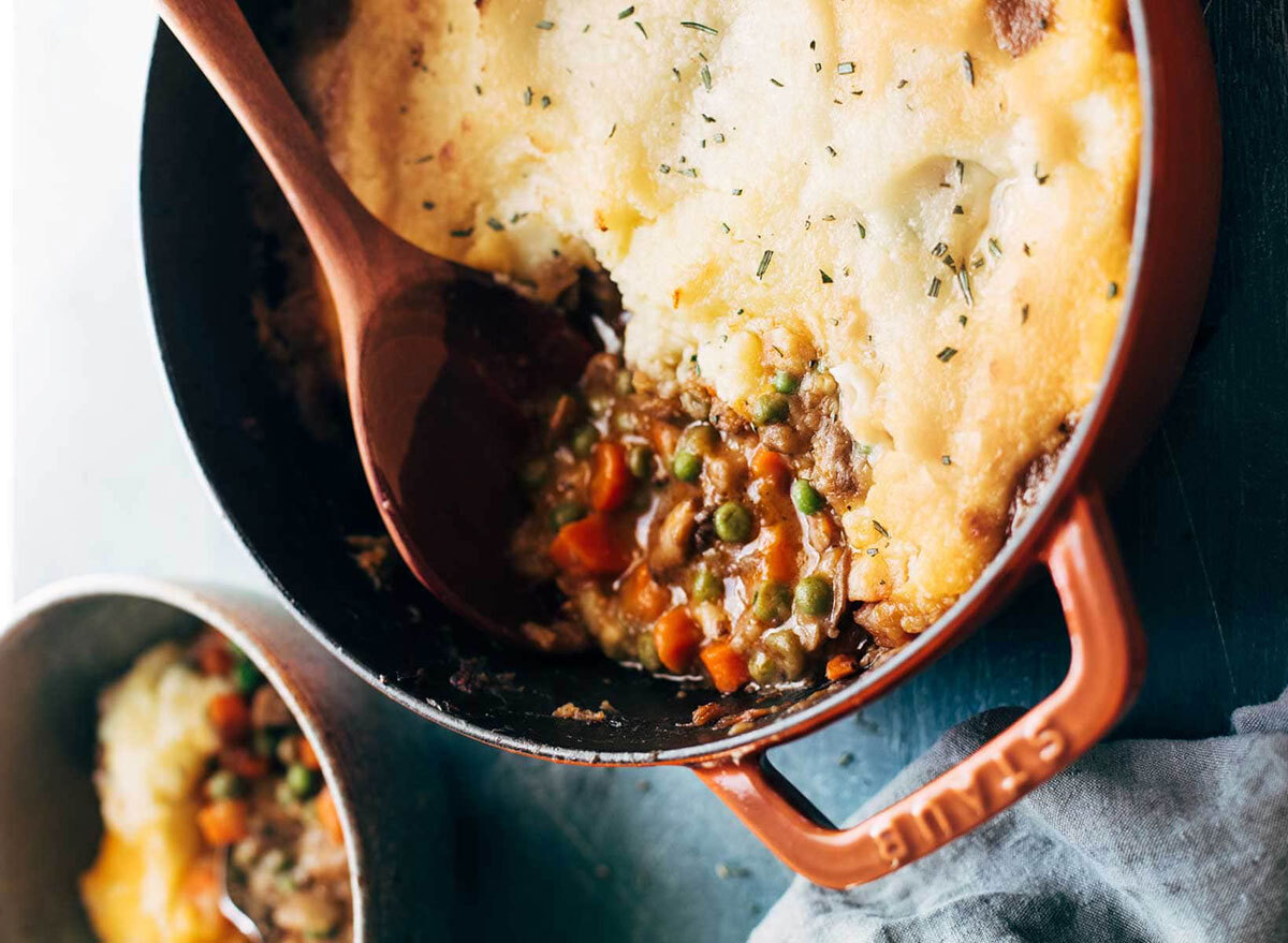 vegetarian shepherds pie with peas and carrots in baking dish