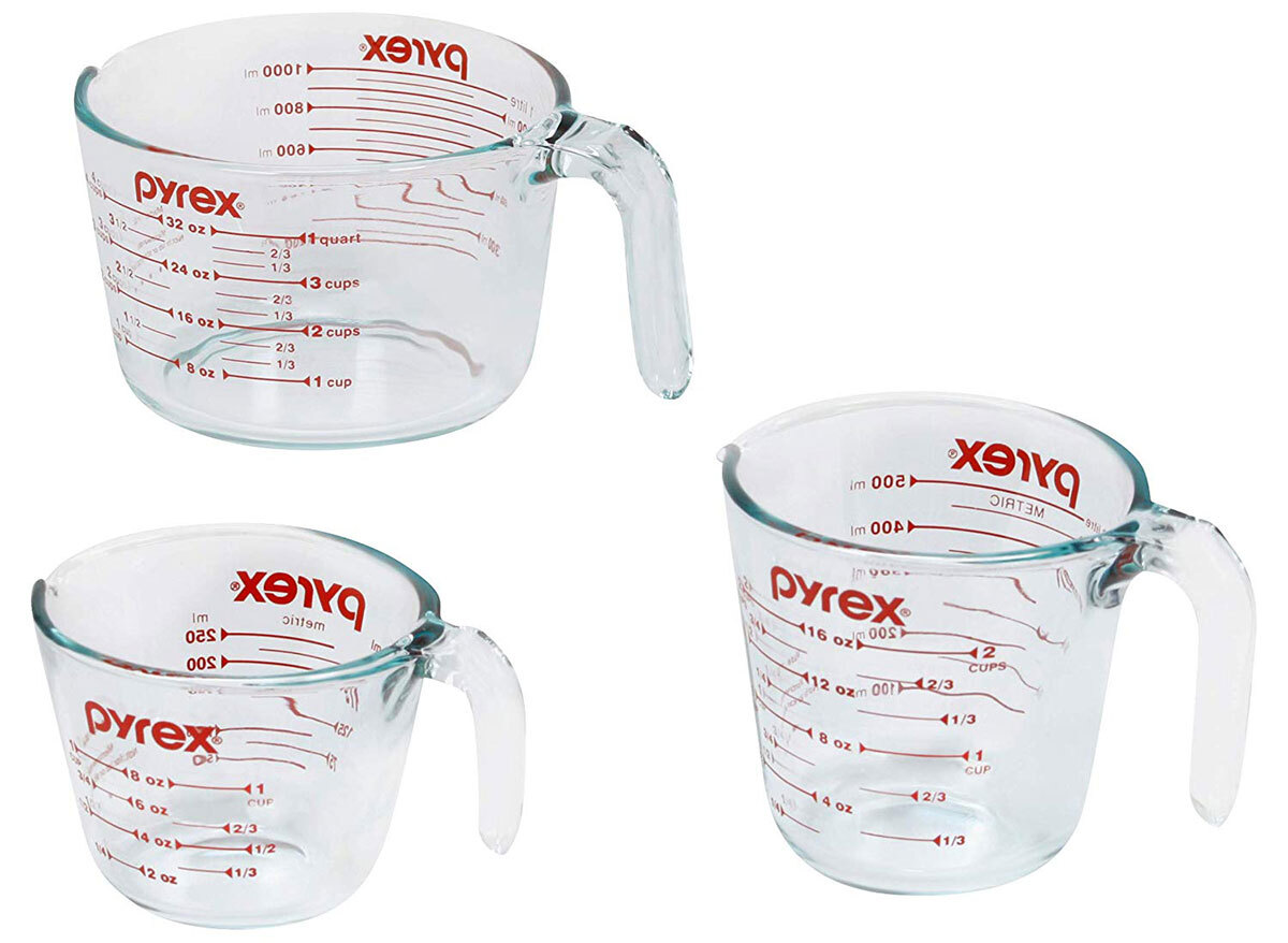 three empty pyrex glass measuring cups