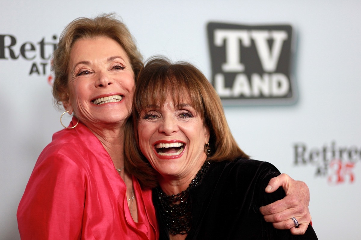 jessica walter in red top hugging valerie harper in black in front of tv land step-and-repeat